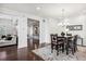 Bright dining room features a chandelier and seating for six at 9167 E 35Th Ave, Denver, CO 80238