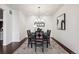 Modern dining room with a chandelier and art piece at 9167 E 35Th Ave, Denver, CO 80238