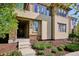 Front view of a two-story home with landscaping and a stone facade at 9167 E 35Th Ave, Denver, CO 80238