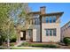 Two-story home with stone and stucco exterior, and a front porch at 9167 E 35Th Ave, Denver, CO 80238