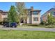 Two-story house with beige siding and landscaping at 9167 E 35Th Ave, Denver, CO 80238