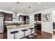 Gourmet kitchen boasts granite countertops and stainless steel appliances at 9167 E 35Th Ave, Denver, CO 80238