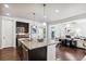 Modern kitchen with large island, stainless steel appliances at 9167 E 35Th Ave, Denver, CO 80238