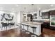 Spacious kitchen with dark brown cabinets, granite countertops, and stainless steel appliances at 9167 E 35Th Ave, Denver, CO 80238