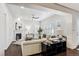 Living room with fireplace, light-colored sectional sofa, and large windows at 9167 E 35Th Ave, Denver, CO 80238