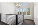 Bright landing area with chandelier and large windows at 9167 E 35Th Ave, Denver, CO 80238