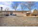 Large backyard with patio and partial fence at 6440 - 6450 W 35Th Ave, Wheat Ridge, CO 80033