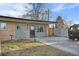 Ranch-style home with brick facade and driveway parking at 6440 - 6450 W 35Th Ave, Wheat Ridge, CO 80033