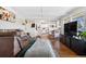 Open living room with a view into the updated kitchen at 6440 - 6450 W 35Th Ave, Wheat Ridge, CO 80033