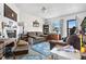 Cozy living room featuring fireplace and large windows at 6440 - 6450 W 35Th Ave, Wheat Ridge, CO 80033