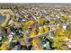 Aerial view of a neighborhood with tree-lined streets and solar panels during the colorful autumn season at 10971 Bryant St, Westminster, CO 80234