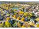 Stunning aerial view of neighborhood with lake, open space, and fall foliage at 10971 Bryant St, Westminster, CO 80234