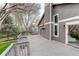 Spacious wooden deck for outdoor entertaining with gray siding and views of a wooded area at 10971 Bryant St, Westminster, CO 80234