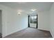 Spacious bedroom featuring neutral carpet, light fixtures, and access to closet at 10971 Bryant St, Westminster, CO 80234
