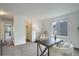 Bright room featuring neutral carpet, a desk with chairs and closet at 10971 Bryant St, Westminster, CO 80234