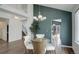 Open dining space with stylish lighting, hardwood floors, and a view into the adjacent rooms, creating an inviting atmosphere at 10971 Bryant St, Westminster, CO 80234