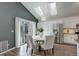 Open concept kitchen and dining area with skylights and stainless steel appliances at 10971 Bryant St, Westminster, CO 80234