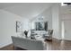 Bright and airy living room features vaulted ceilings, hardwood floors, modern furnishings, and large windows at 10971 Bryant St, Westminster, CO 80234