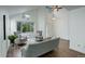 Bright living room boasts vaulted ceilings, wood floors, modern decor, and a large window at 10971 Bryant St, Westminster, CO 80234