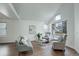 Cozy living room featuring vaulted ceilings, wood floors, neutral decor, and ample natural light at 10971 Bryant St, Westminster, CO 80234