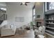 Cozy living room featuring a fireplace and large windows with plenty of natural light at 10971 Bryant St, Westminster, CO 80234