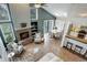 Open floor plan with a fireplace, adjacent dining area, and a breakfast bar at 10971 Bryant St, Westminster, CO 80234