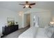 Bright main bedroom showcasing neutral tones, a vaulted ceiling, and modern decor at 10971 Bryant St, Westminster, CO 80234