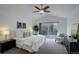 Serene main bedroom with a sliding door to a private deck and ample natural light at 10971 Bryant St, Westminster, CO 80234