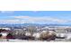 Community view showcasing snowy landscape and mountain backdrop at 6017 Thunder Hill Rd, Parker, CO 80134