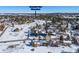 Aerial view of house, neighborhood, and nearby Mountain View Elementary School at 6017 Thunder Hill Rd, Parker, CO 80134