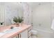 Full bathroom with floral wallpaper, tub and vanity at 6017 Thunder Hill Rd, Parker, CO 80134