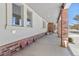 Covered patio with brick pillars and access to the home at 6017 Thunder Hill Rd, Parker, CO 80134