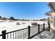 Deck overlooking snowy landscape with mountain views at 6017 Thunder Hill Rd, Parker, CO 80134