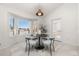 Bright dining area with bay window offering scenic views at 6017 Thunder Hill Rd, Parker, CO 80134