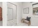 Bright entryway with tiled floors and coat closet at 6017 Thunder Hill Rd, Parker, CO 80134