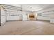 Large garage with ample storage cabinets and overhead storage at 6017 Thunder Hill Rd, Parker, CO 80134