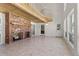 Bright Gathering room with a brick fireplace and vaulted ceilings at 6017 Thunder Hill Rd, Parker, CO 80134