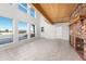 Spacious Gathering room featuring large windows and wood beams at 6017 Thunder Hill Rd, Parker, CO 80134