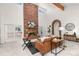 Bright living room featuring a large brick fireplace and high ceilings at 6017 Thunder Hill Rd, Parker, CO 80134