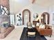 Spacious living room with a brick fireplace and high ceilings at 6017 Thunder Hill Rd, Parker, CO 80134