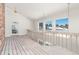 Open loft area with wood flooring and expansive window views at 6017 Thunder Hill Rd, Parker, CO 80134