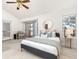 Main bedroom with king-size bed and access to deck at 6017 Thunder Hill Rd, Parker, CO 80134