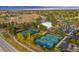 Aerial view of tennis courts and clubhouse at The Pinery Country Club at 6017 Thunder Hill Rd, Parker, CO 80134