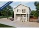 Charming two-story home with a balcony, light-colored siding, and gravel landscaping at 13585 E 103Rd Pl, Commerce City, CO 80022