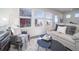 Bright living room with large windows offering neighborhood views at 13585 E 103Rd Pl, Commerce City, CO 80022
