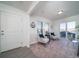Bright living room features modern decor, natural light, and neutral tones at 13585 E 103Rd Pl, Commerce City, CO 80022