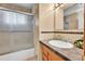 Bathroom featuring tiled shower, sink, and spacious vanity at 7861 Osceola St, Westminster, CO 80030