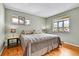 Cozy bedroom with hardwood floors, natural light, and neutral wall color at 7861 Osceola St, Westminster, CO 80030