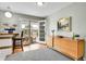 Inviting dining area with hardwood floors, a breakfast bar, and sliding doors to the patio at 7861 Osceola St, Westminster, CO 80030
