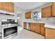 Functional kitchen with stainless steel appliances, ample cabinet space, and natural light at 7861 Osceola St, Westminster, CO 80030